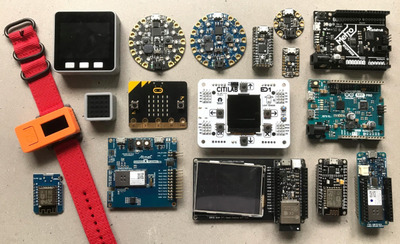 Hands connecting wires to a board